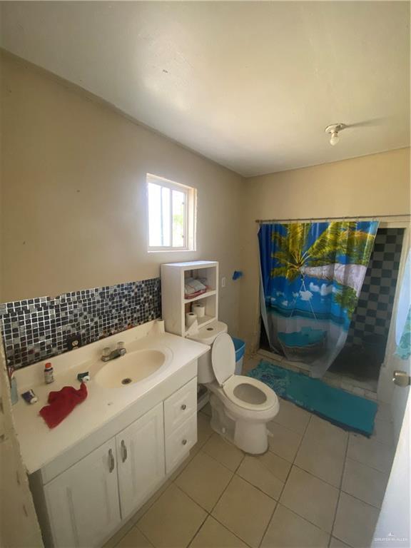 3507 San Rafael Road Mercedes, TX 78570 - Photo 9 of 10 a bathroom with a sink toilet and shower