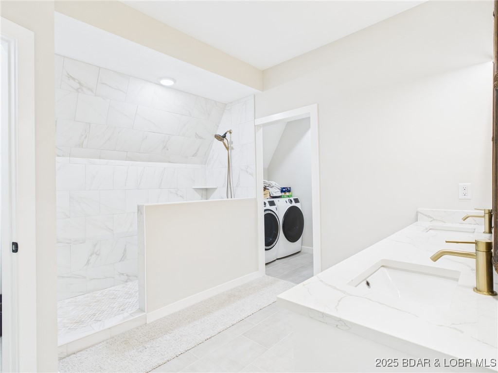 37 Kejo Point Road Gravois Mills, MO 65037 - Photo 13 of 31 Primary bathroom and laundry room.