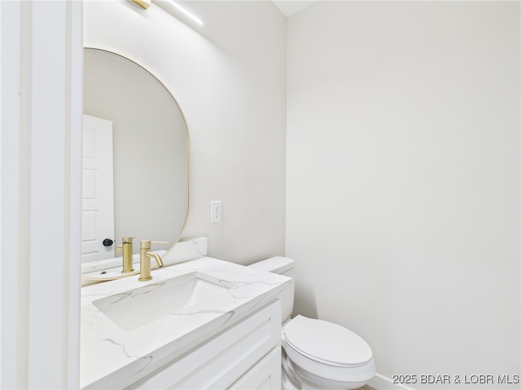 37 Kejo Point Road Gravois Mills, MO 65037 - Photo 10 of 31 Half bath on main level.