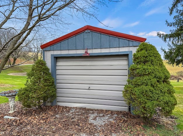 Garage featuring a yard