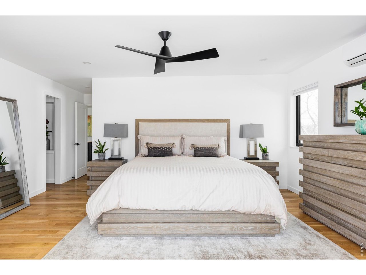 3560 16th Street Boulder, CO 80304 - Photo 18 of 36 The upper level is a private retreat, crowned by a stunning primary suite with sweeping views of Mt. Sanitas across Boulder's Front Range and private deck access.