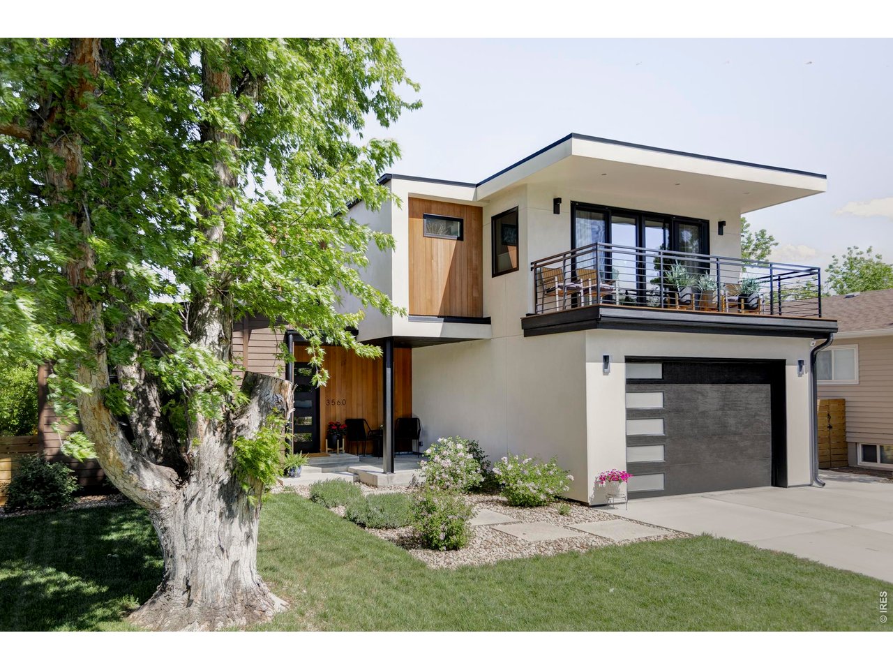 3560 16th Street Boulder, CO 80304 - Photo 2 of 36 a front view of a house with garden