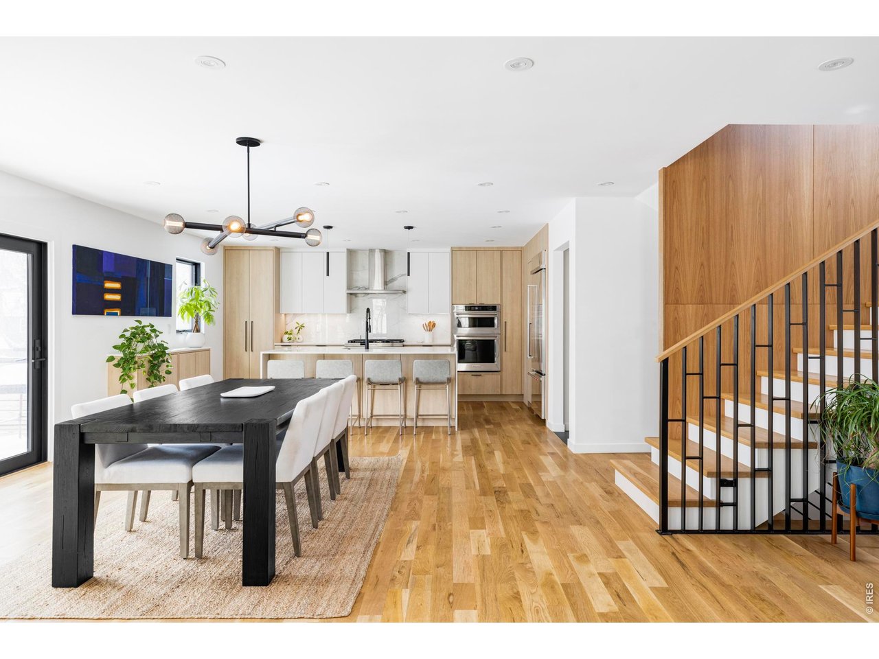 3560 16th Street Boulder, CO 80304 - Photo 5 of 36 Light-filled interiors welcome you into the main level, where wide-plank hardwood floors flow seamlessly through an open-concept great room.