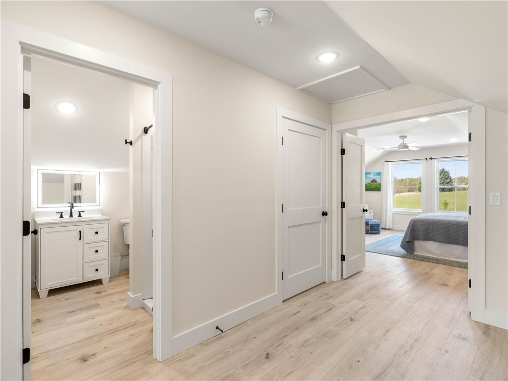331 Bakerville Road Easley, SC 29642 - Photo 34 of 43 This bright hallway connects a stylish bathroom to a welcoming bedroom with expansive views.