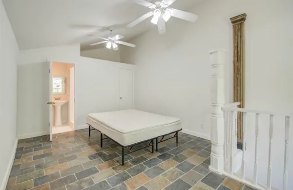 a room with pool table and windows