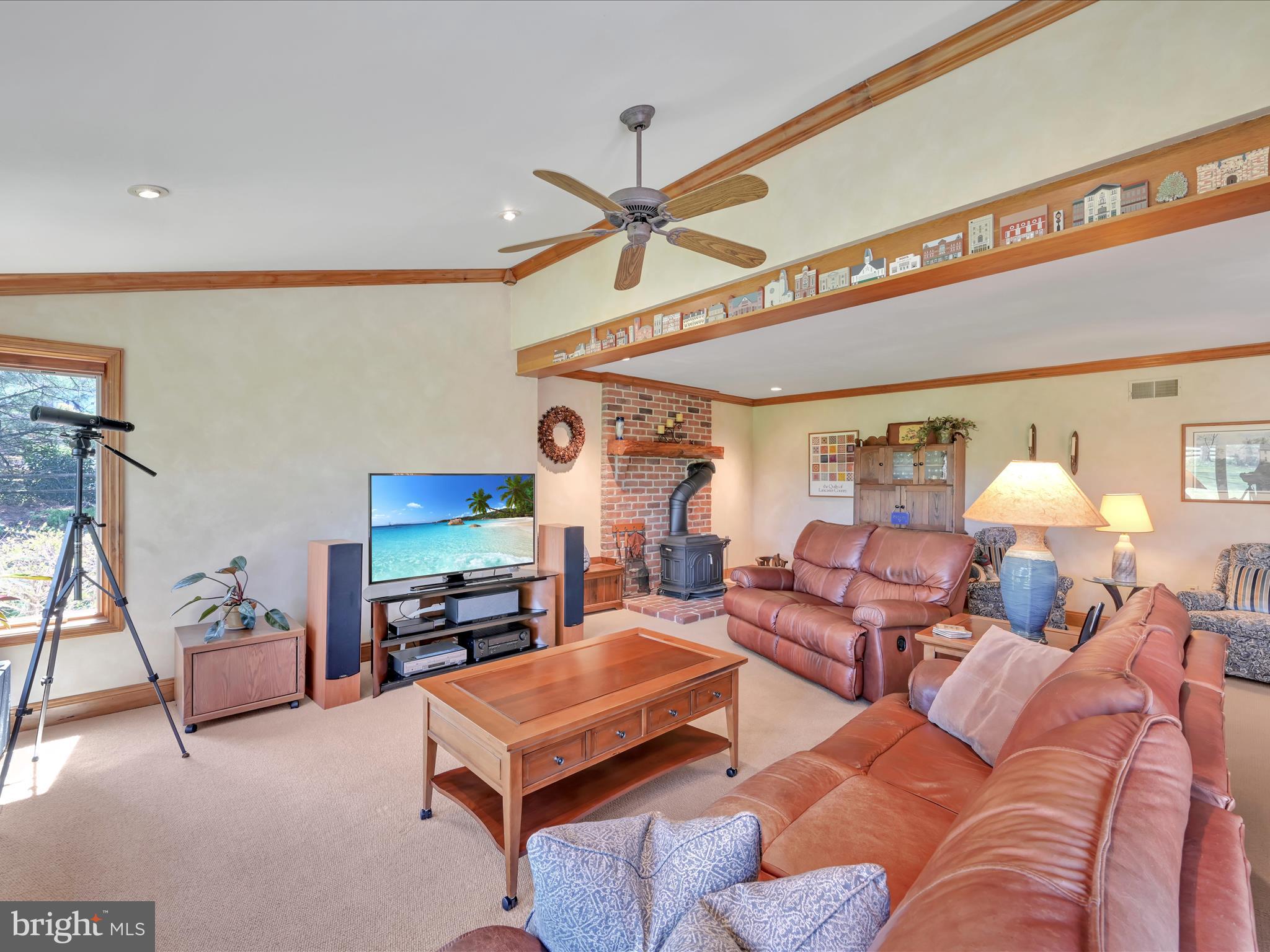 29 Church Road Lancaster, PA 17603 - Photo 18 of 64 a living room with furniture a ceiling fan and a flat screen tv