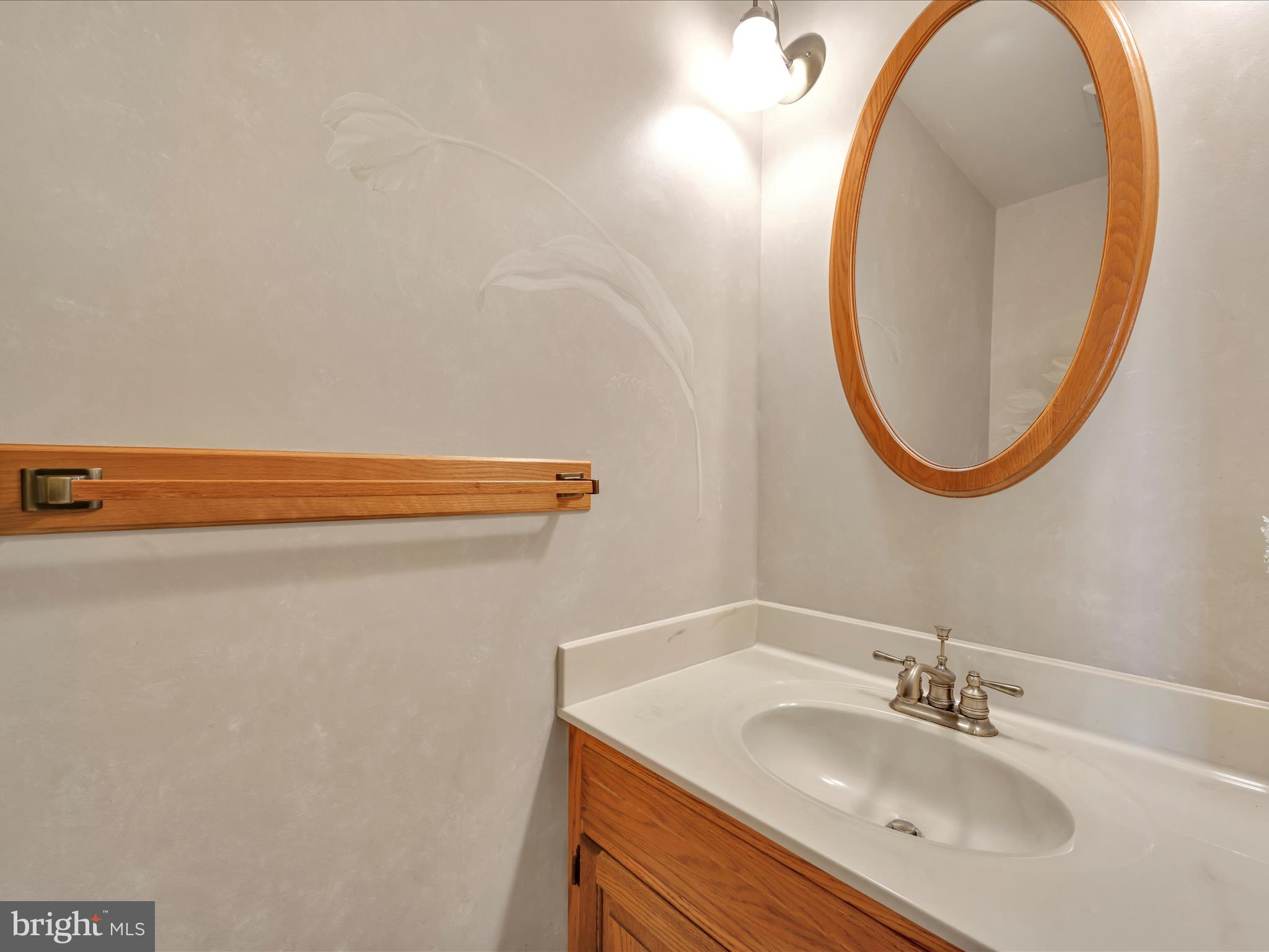 29 Church Road Lancaster, PA 17603 - Photo 20 of 64 a bathroom with a sink and a mirror