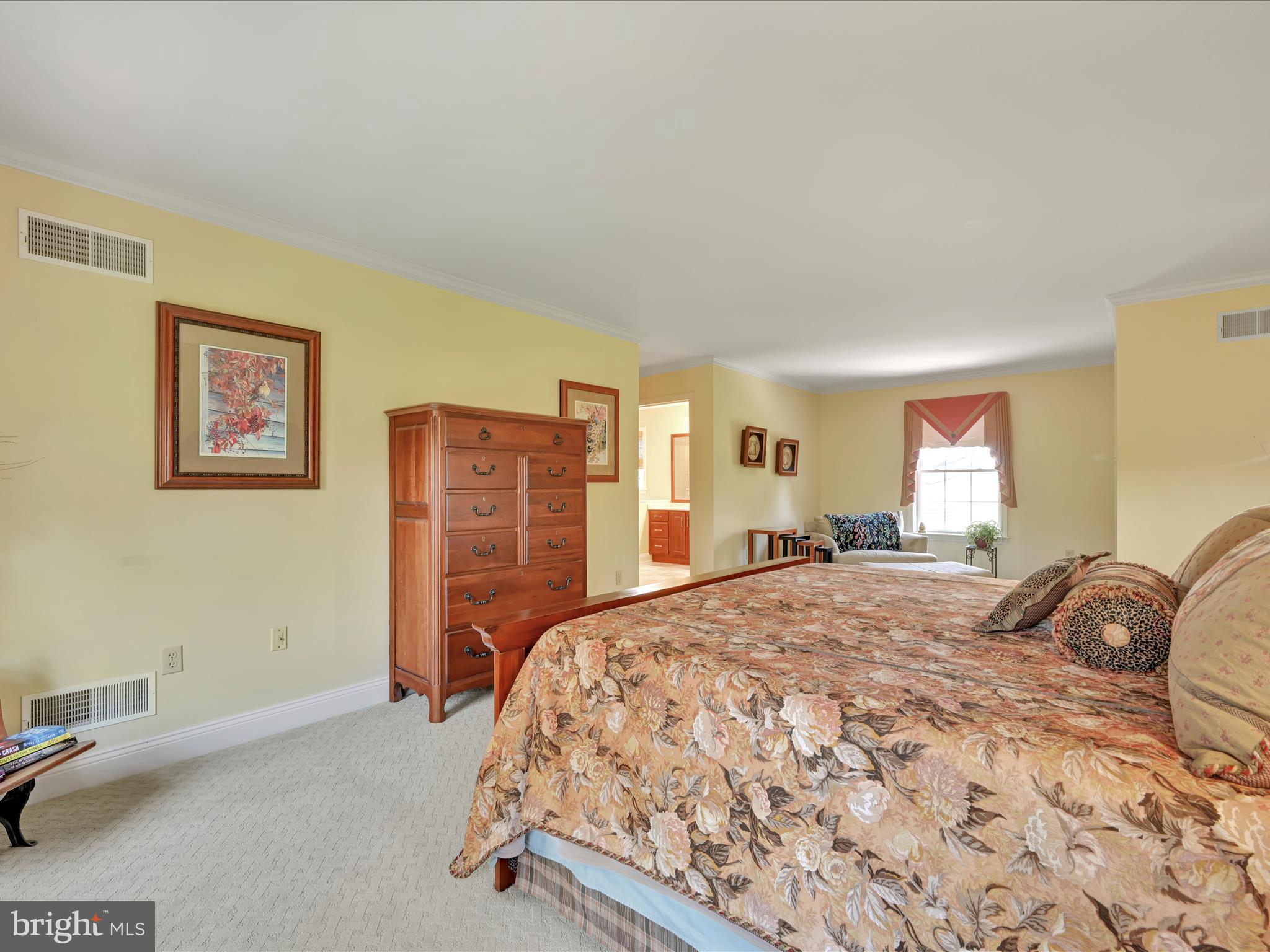 29 Church Road Lancaster, PA 17603 - Photo 22 of 64 a bedroom with a bed and dresser with mirror