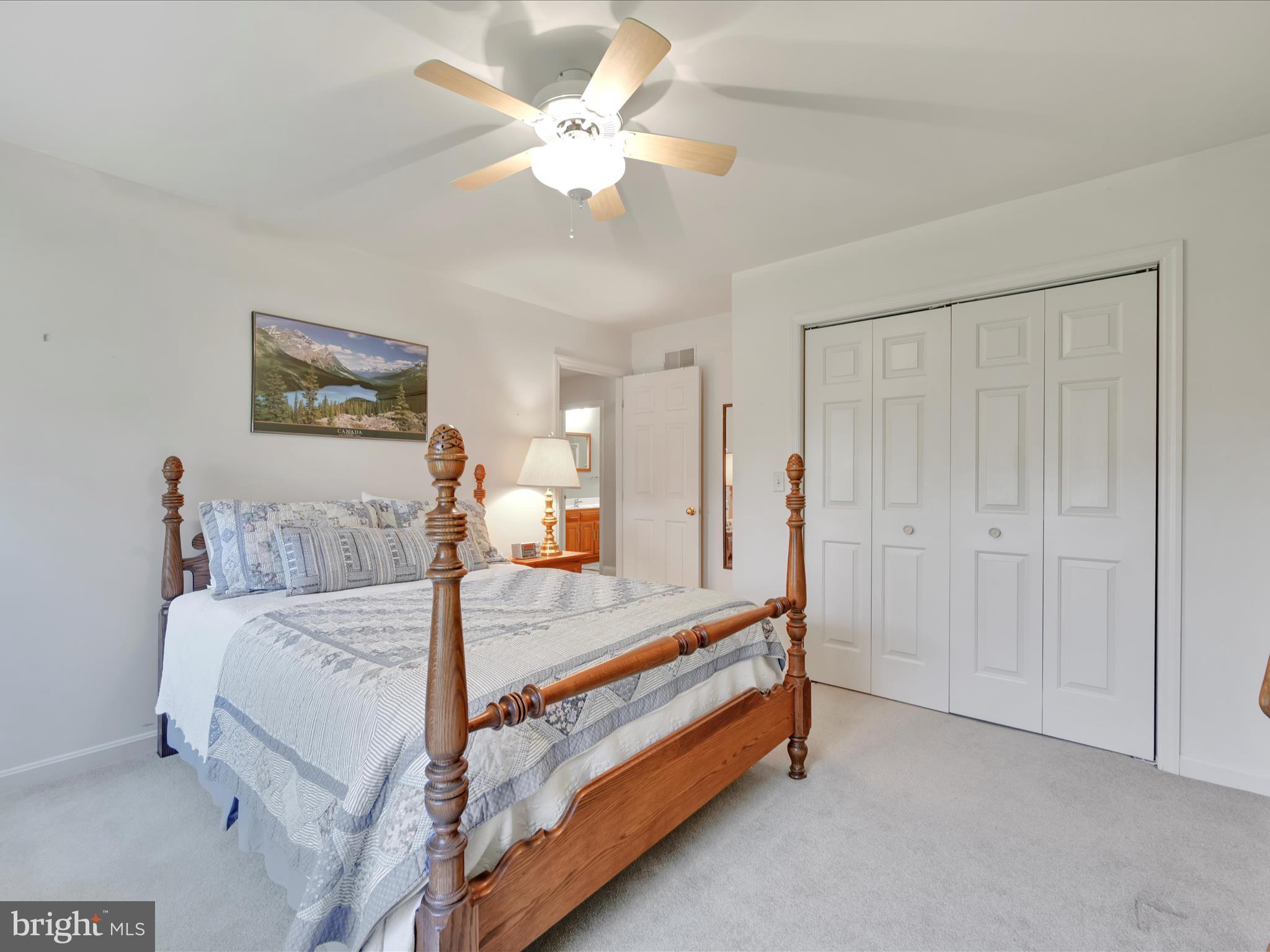 29 Church Road Lancaster, PA 17603 - Photo 29 of 64 a bedroom with a bed and a chandelier