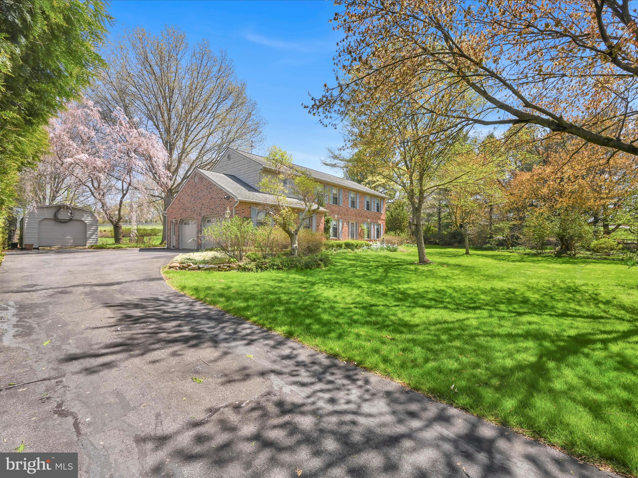 29 Church Road Lancaster, PA 17603 - Photo 38 of 64 a view of a yard with plants and large trees