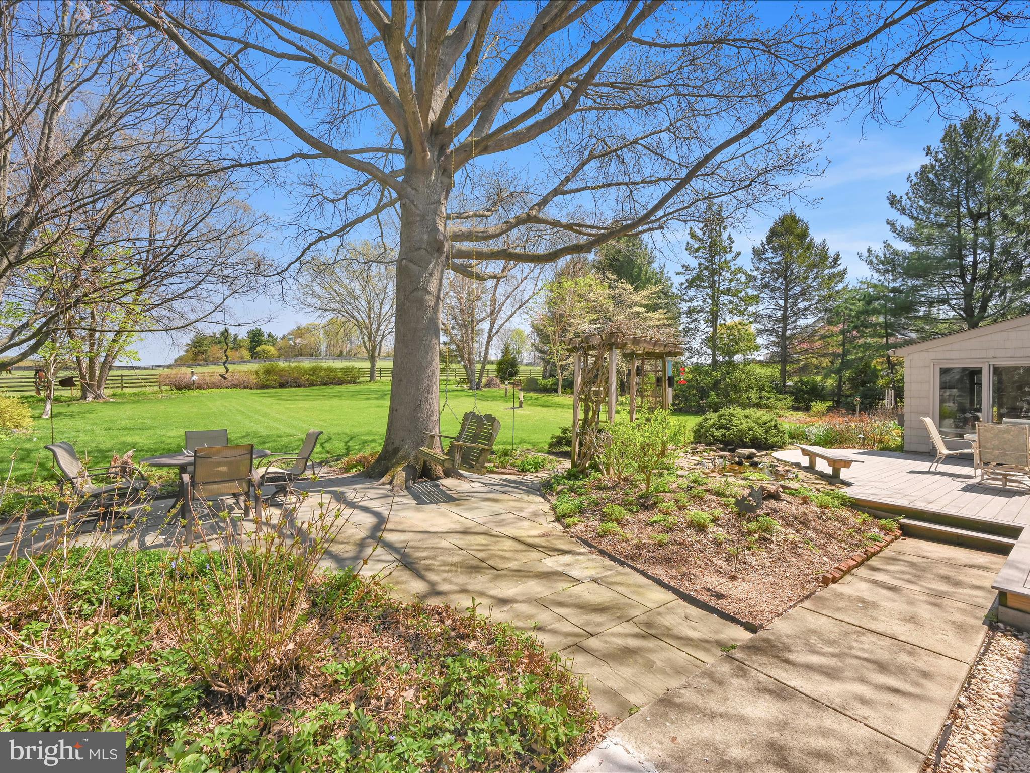 29 Church Road Lancaster, PA 17603 - Photo 39 of 64 a view of a backyard with table and chairs under an umbrella