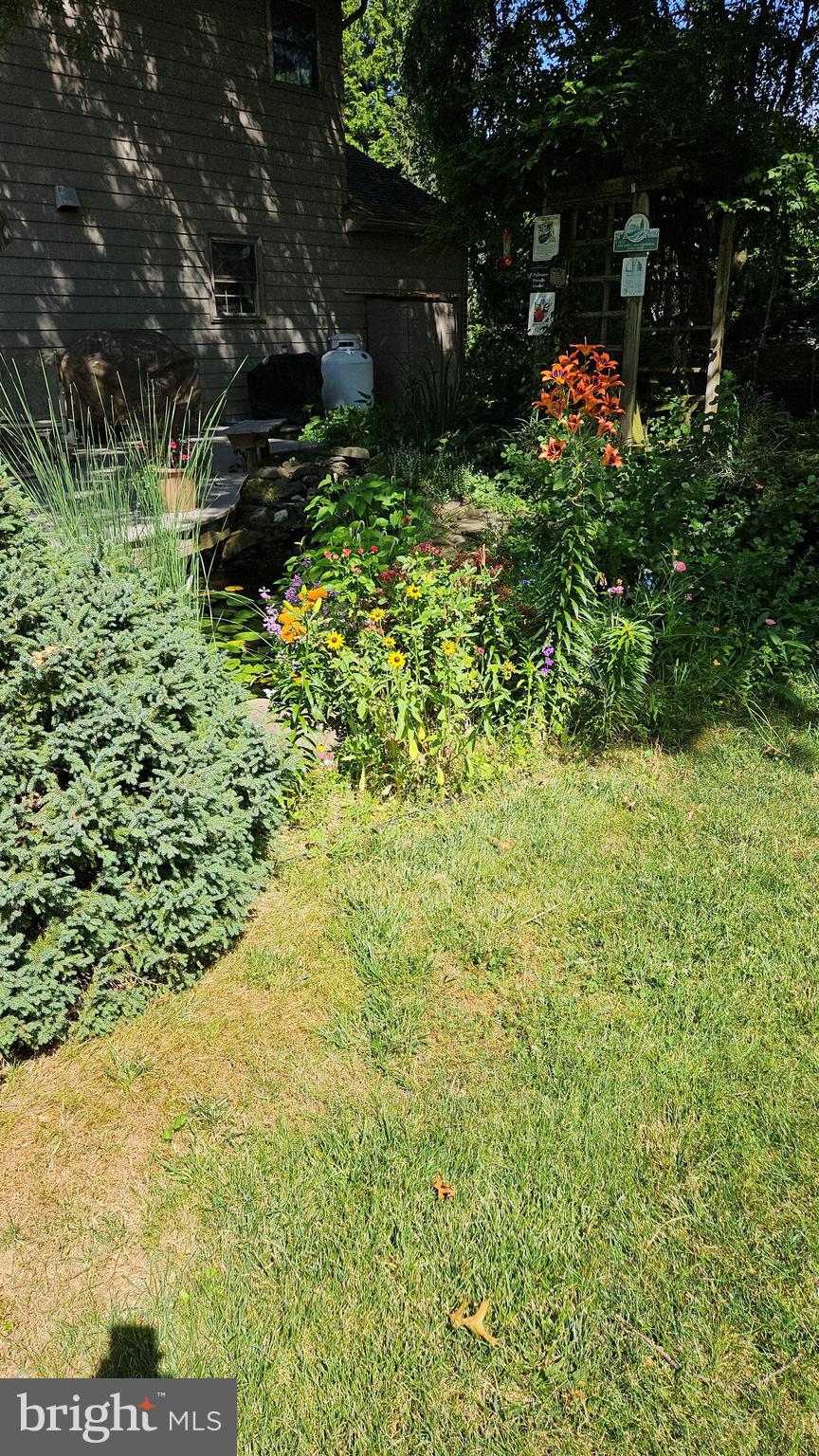 29 Church Road Lancaster, PA 17603 - Photo 64 of 64 a backyard of a house with lots of green space and garden