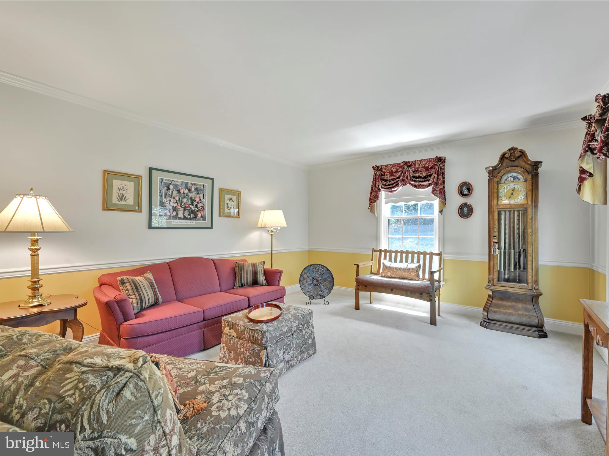 29 Church Road Lancaster, PA 17603 - Photo 8 of 64 a living room with furniture and a lamp