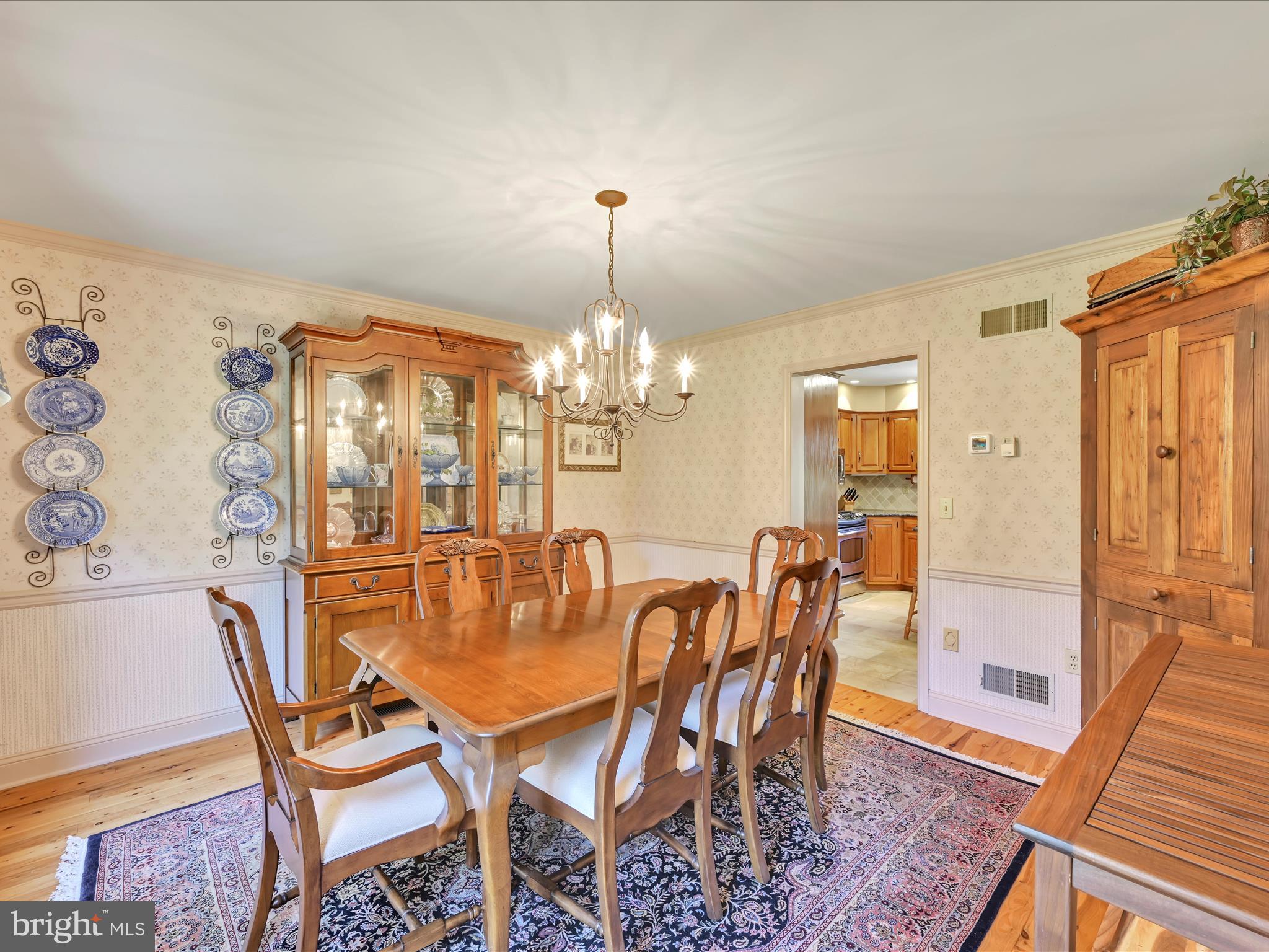 29 Church Road Lancaster, PA 17603 - Photo 10 of 64 a dining room with furniture a chandelier and wooden floor