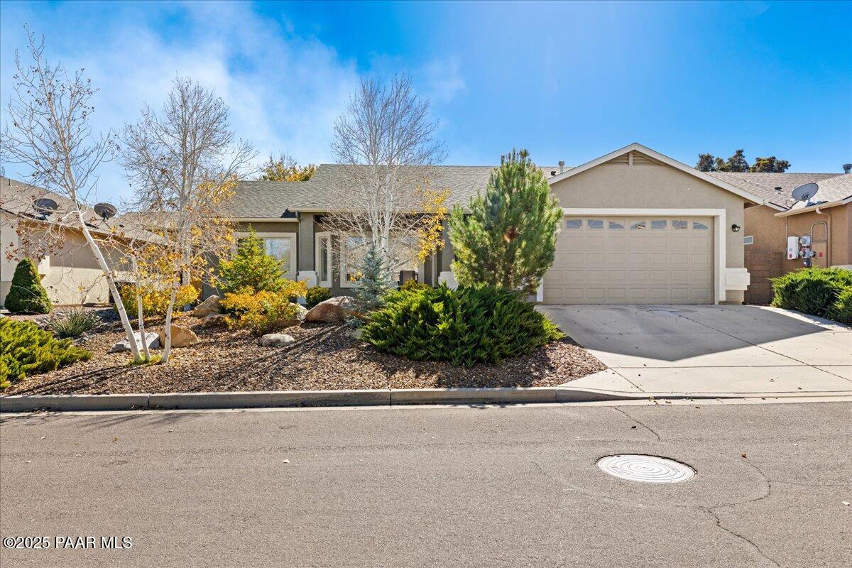 6609 Farmstead Road Prescott Valley, AZ 86314 - Photo 1 of 27 a view of a house with a yard and potted plants