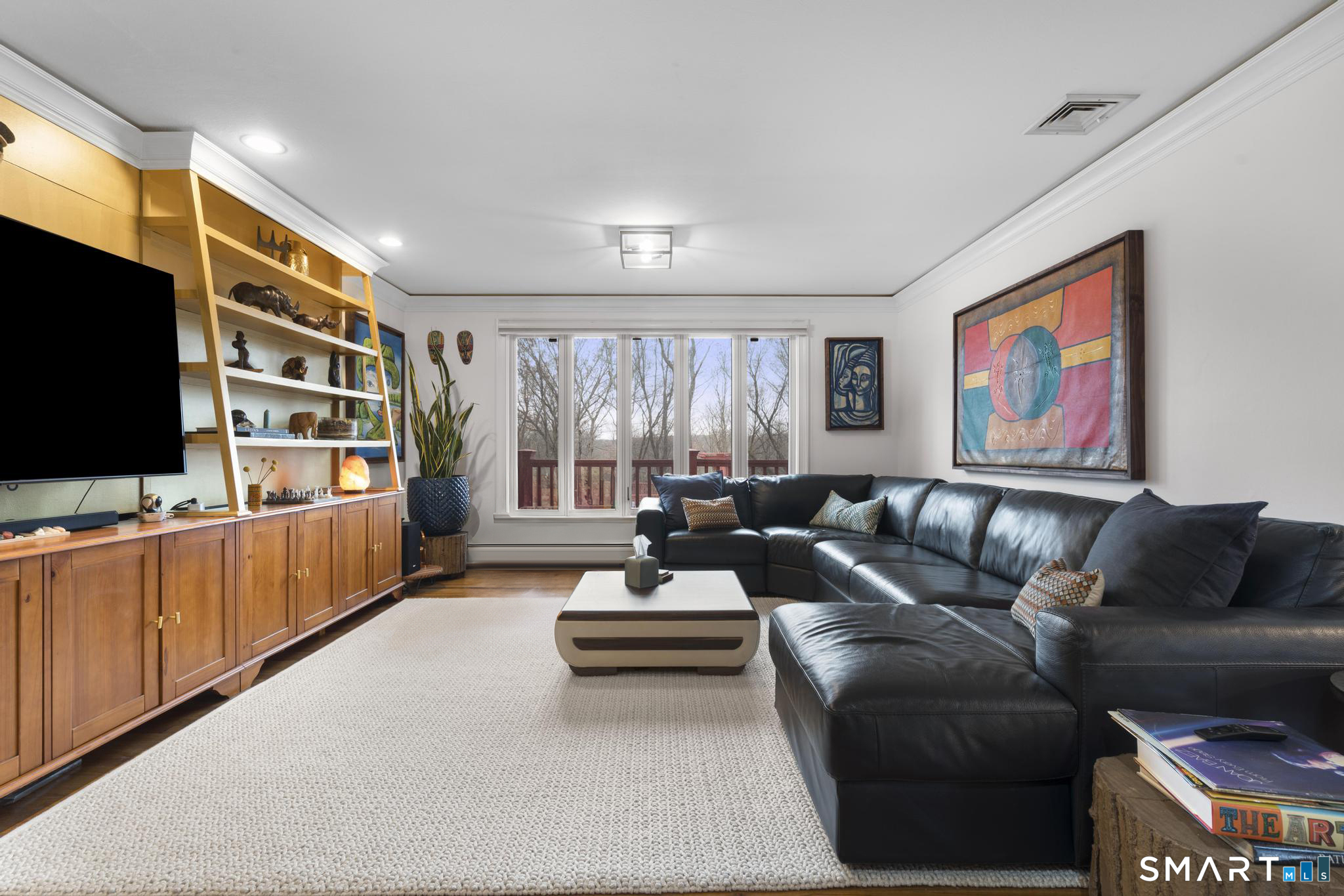 57 Gray Rock Road Trumbull, CT 06611 - Photo 16 of 40 a living room with furniture and a flat screen tv