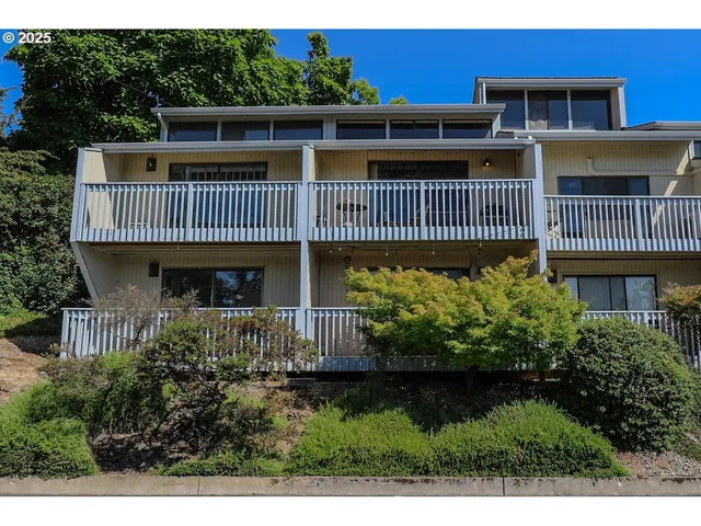 a view of a house with wooden deck
