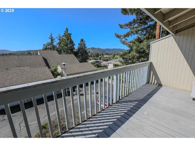 a view of balcony with wooden floor