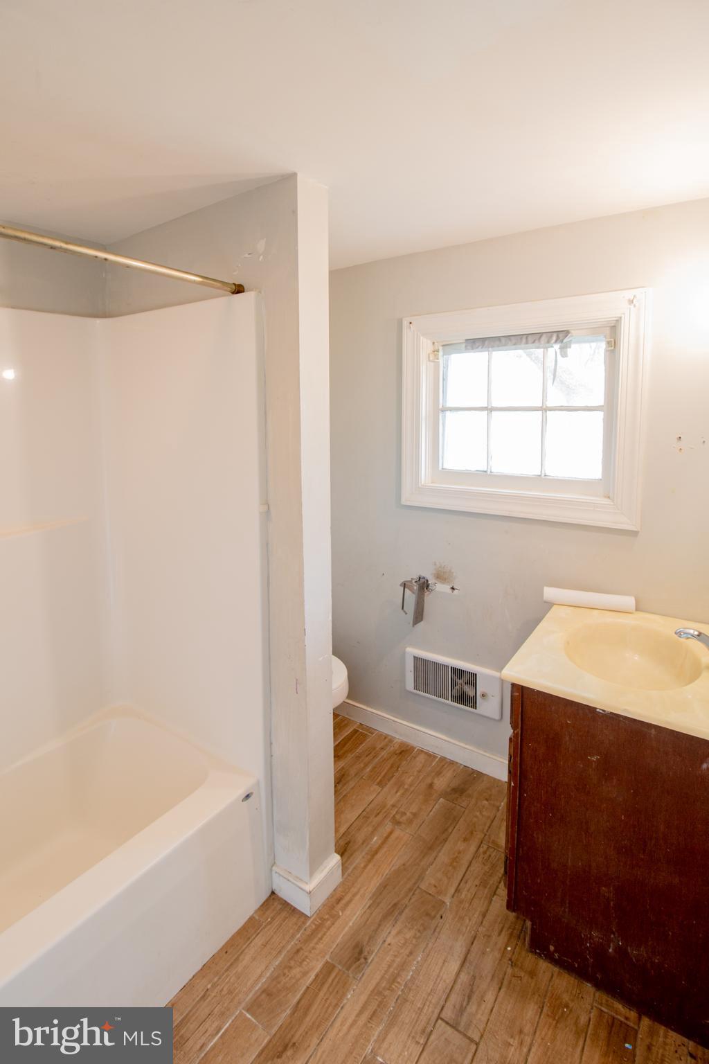198 Mt Hope Church Road Bumpass, VA 23024 - Photo 15 of 25 a spacious bathroom with a tub shower and a sink