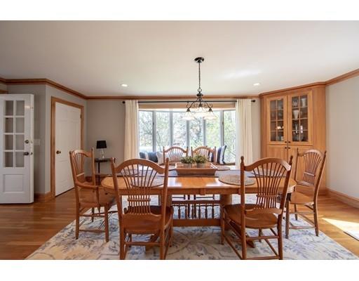 56 Gleason Road Reading, MA 01867 - Photo 27 of 32 a view of a dining room with furniture window and wooden floor