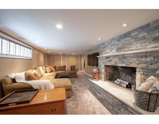 56 Gleason Road Reading, MA 01867 - Photo 9 of 32 a living room with furniture and a fireplace