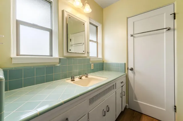 a bathroom with a sink and a mirror