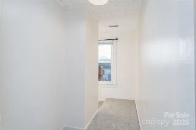 a view of water heater and kitchen floor