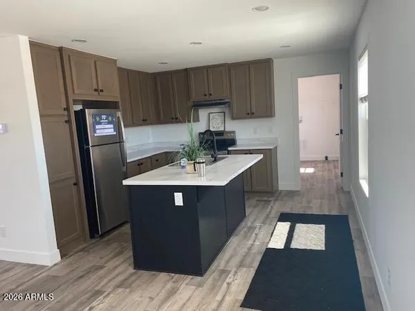 a kitchen with a sink a stove and refrigerator