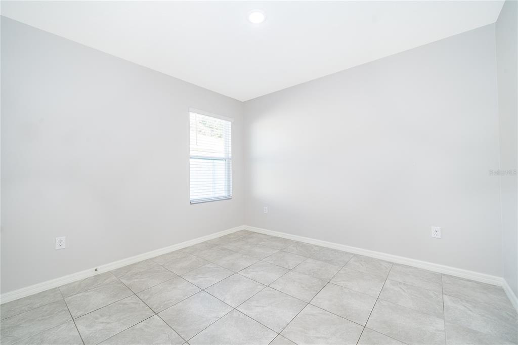 3102 Bethpage Loop Mount Dora, FL 32757 - Photo 17 of 29 an empty room with windows