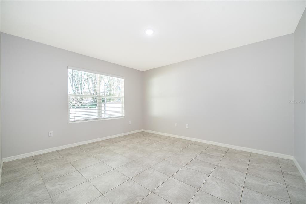 3102 Bethpage Loop Mount Dora, FL 32757 - Photo 18 of 29 an empty room with windows