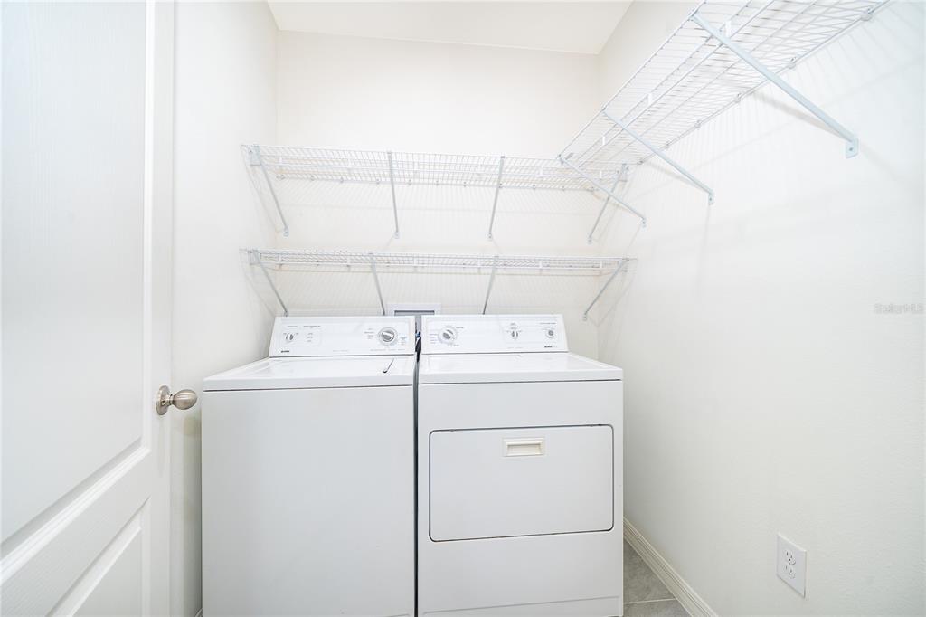 3102 Bethpage Loop Mount Dora, FL 32757 - Photo 20 of 29 a utility room with dryer and washer