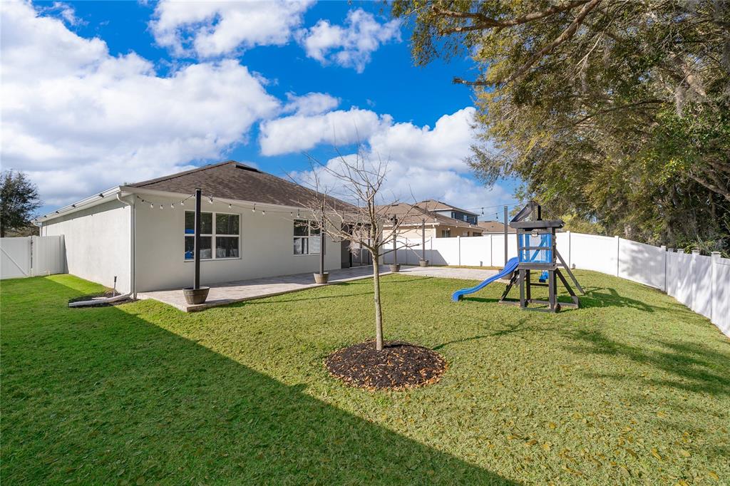 3102 Bethpage Loop Mount Dora, FL 32757 - Photo 27 of 29 a view of a playground with a house