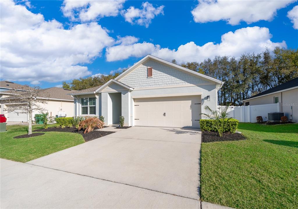 3102 Bethpage Loop Mount Dora, FL 32757 - Photo 3 of 29 a front view of a house with garden