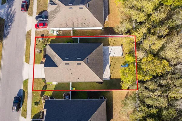 an aerial view of house with pool outdoor seating