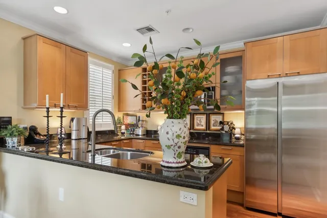 a kitchen with counter top space and stainless steel appliances
