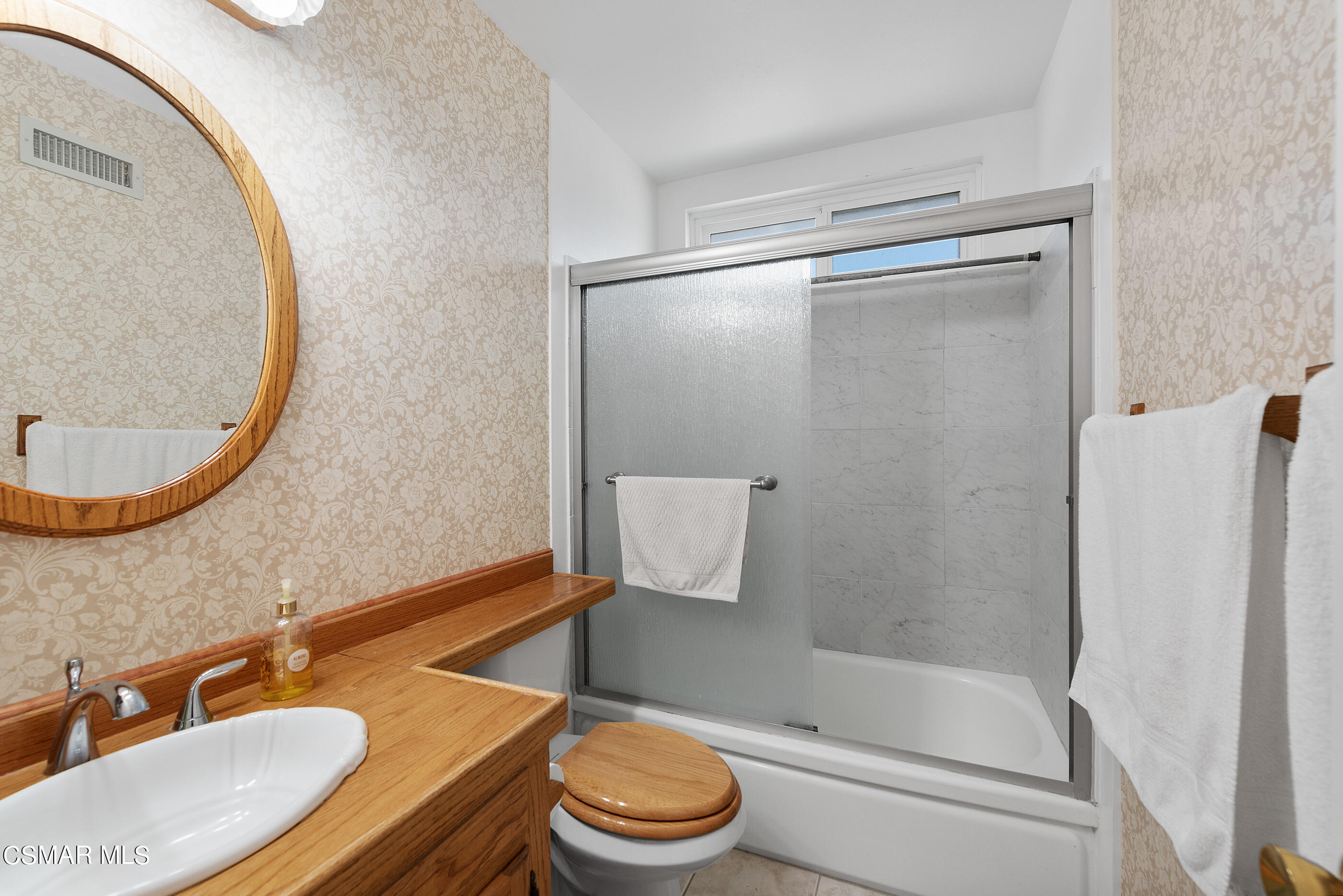 3291 Travis Avenue Simi Valley, CA 93063 - Photo 30 of 54 a bathroom with a sink a toilet and a mirror