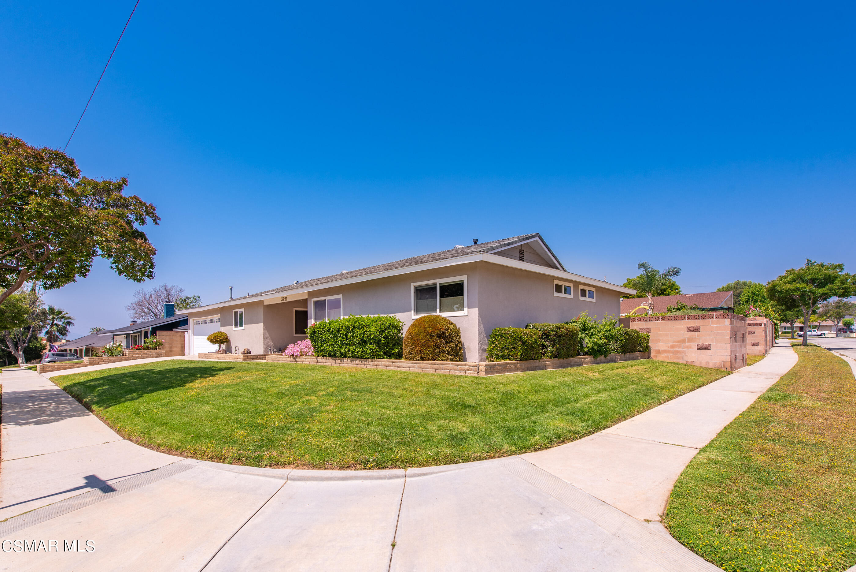 3291 Travis Avenue Simi Valley, CA 93063 - Photo 47 of 54 a view of a big house with a big yard and potted plants