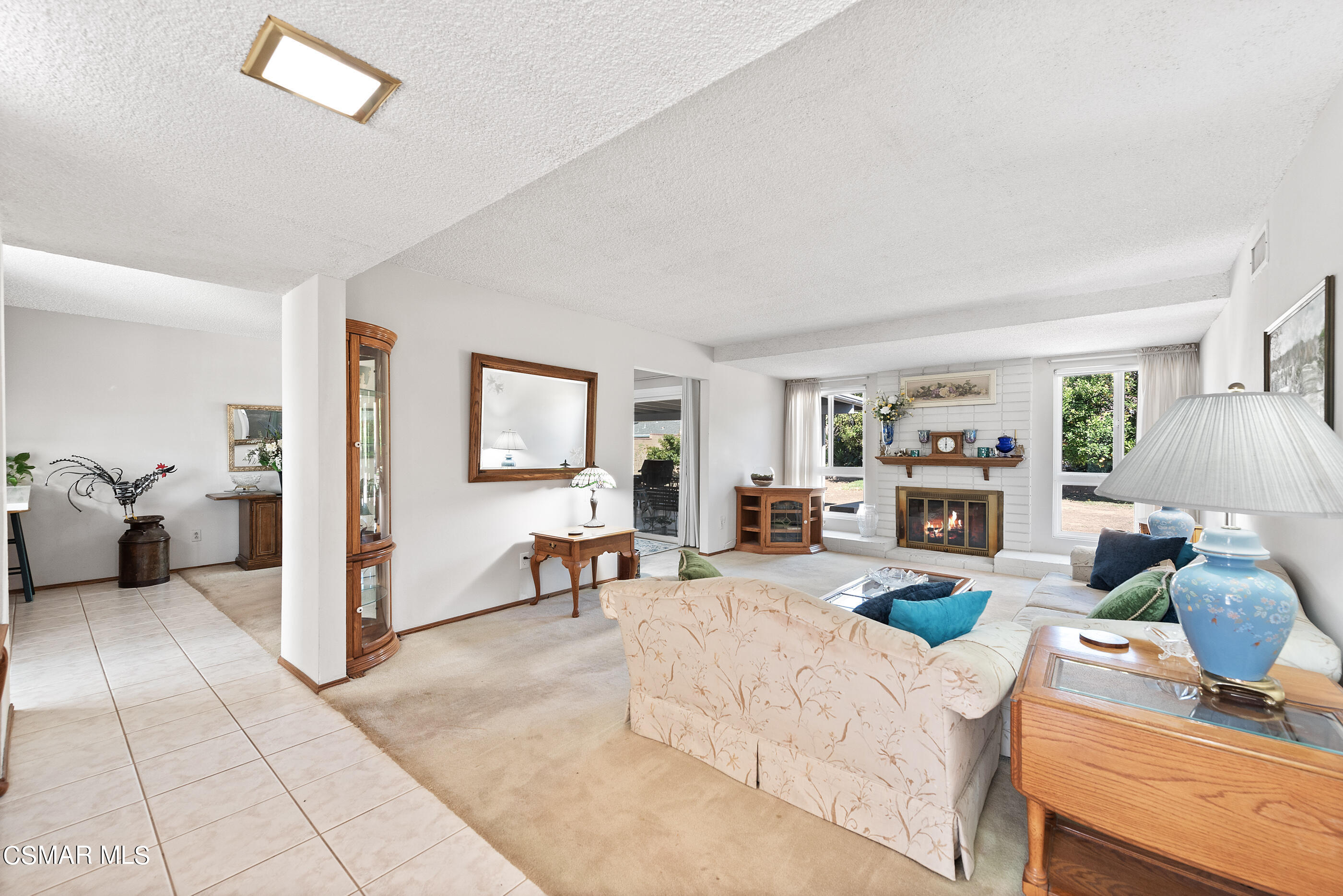 3291 Travis Avenue Simi Valley, CA 93063 - Photo 5 of 54 a living room with furniture and a flat screen tv