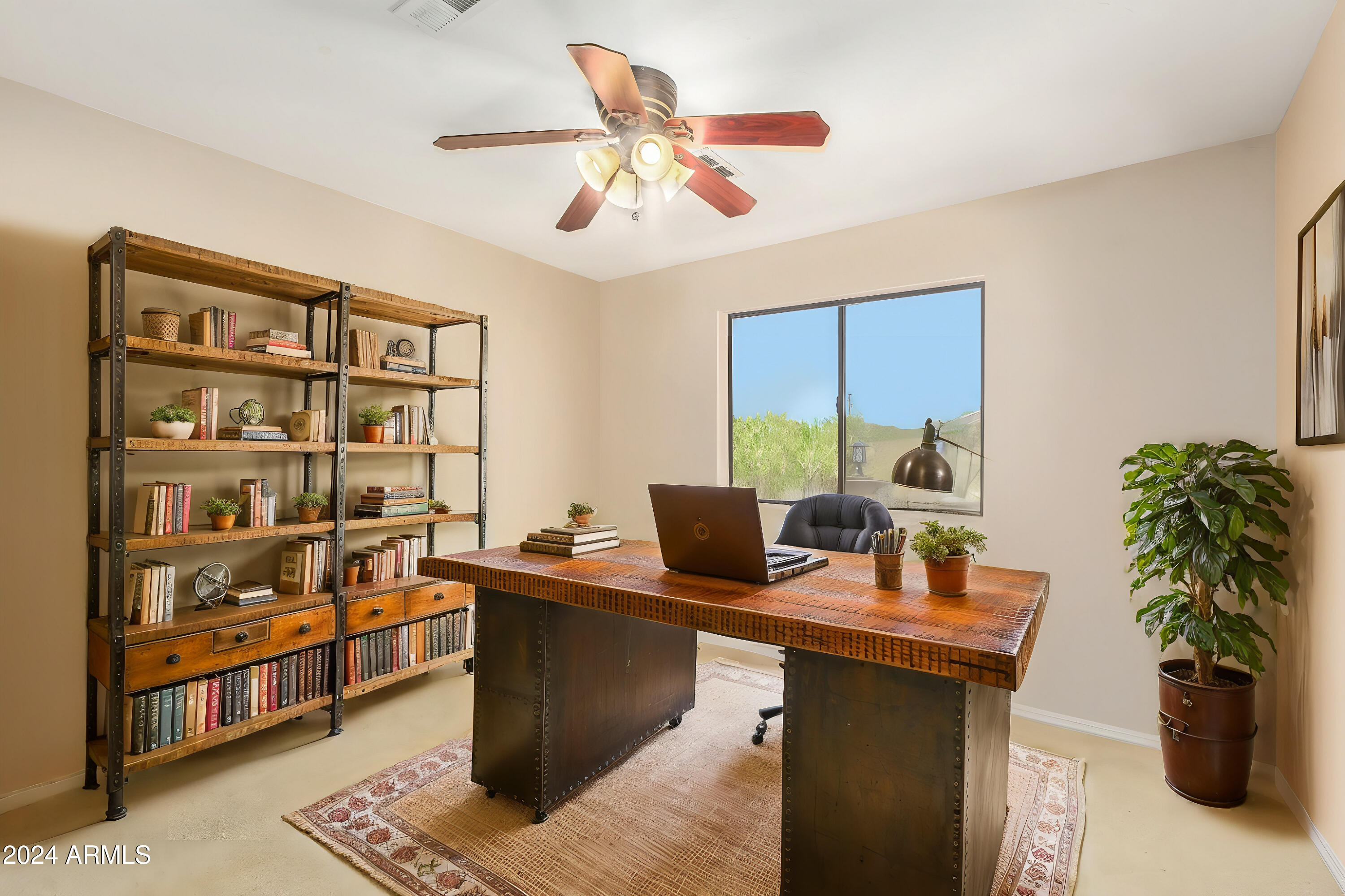57 North Roadrunner Road Apache Junction, AZ 85119 - Photo 19 of 44 a work room with furniture and a potted plant