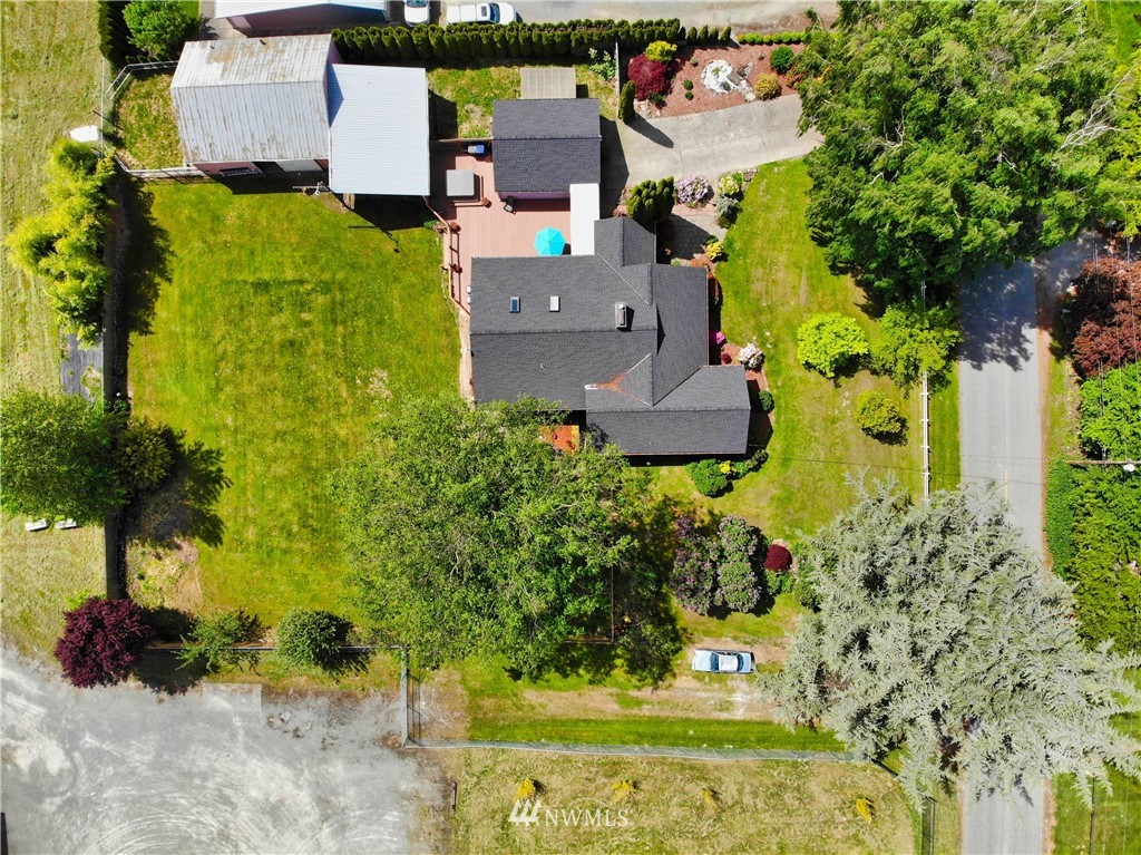 17566 Dunbar Road Mount Vernon, WA 98273 - Photo 1 of 40 an aerial view of a house with a yard swimming pool and outdoor seating