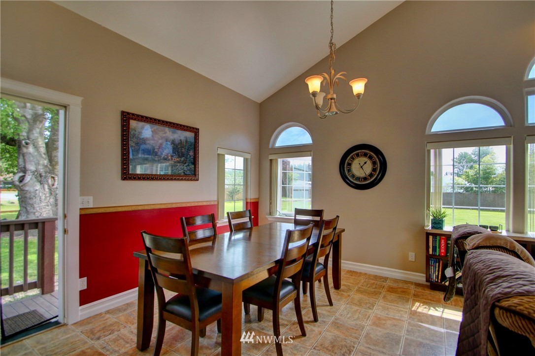 17566 Dunbar Road Mount Vernon, WA 98273 - Photo 12 of 40 a view of a dining room with furniture and chandelier