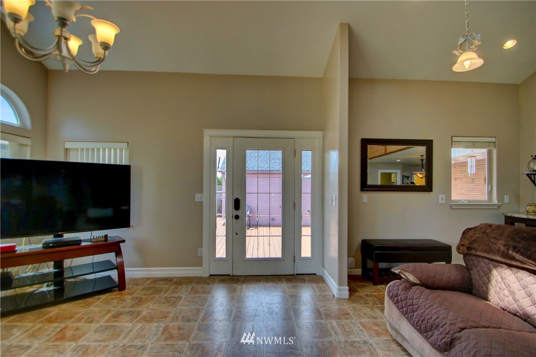 17566 Dunbar Road Mount Vernon, WA 98273 - Photo 13 of 40 a living room with furniture and a flat screen tv