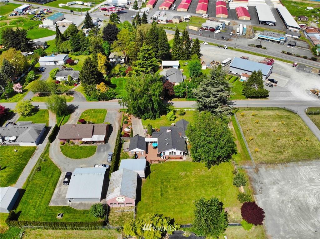17566 Dunbar Road Mount Vernon, WA 98273 - Photo 20 of 40 an aerial view of a house with a yard swimming pool and tennis court