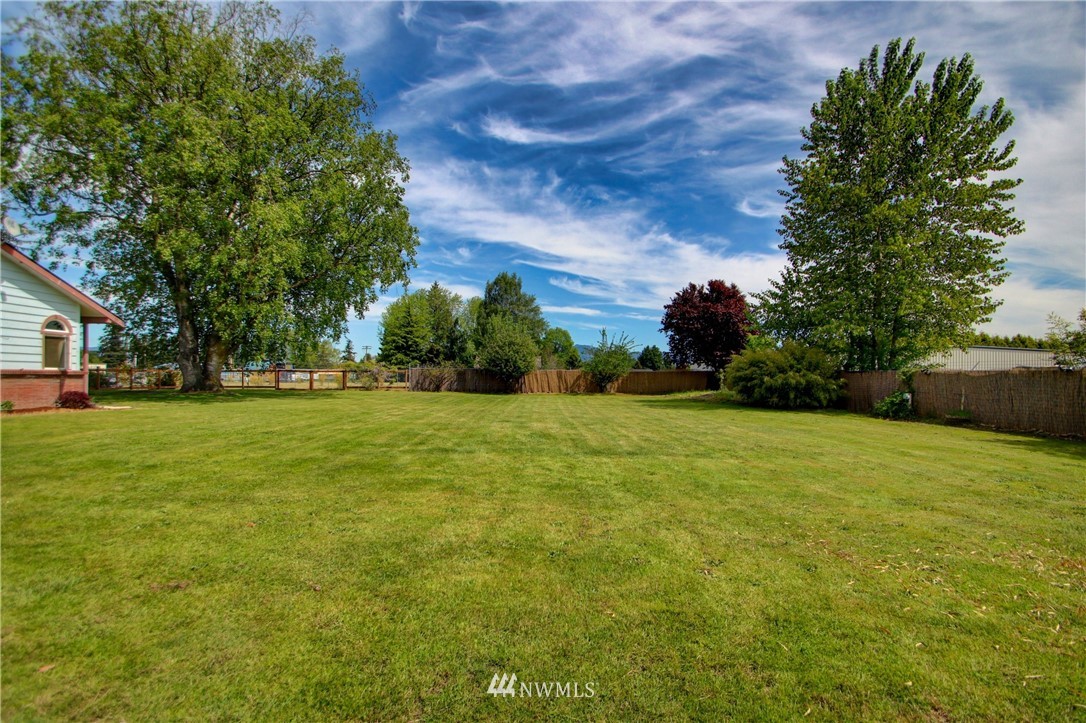 17566 Dunbar Road Mount Vernon, WA 98273 - Photo 40 of 40 a view of green field with trees in the background