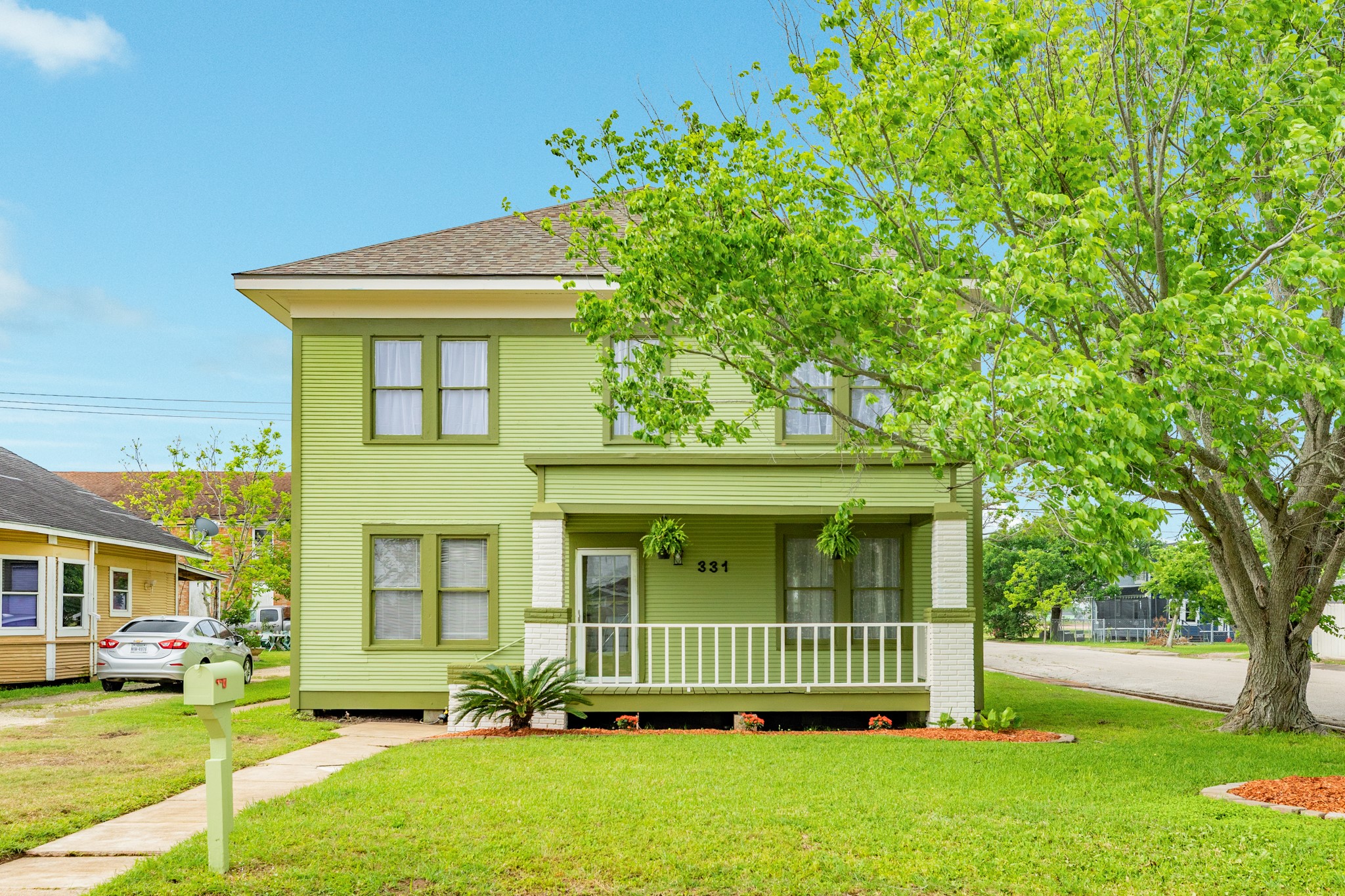 331 West Broad Street Freeport, TX 77541 - Photo 2 of 31 a view of a house with a garden