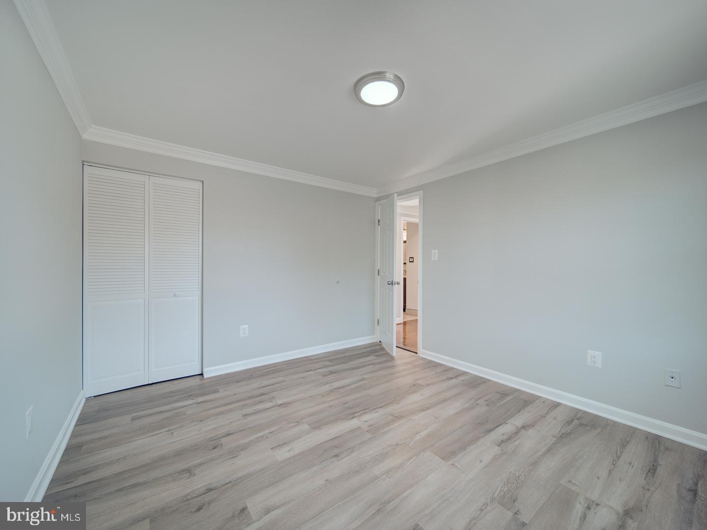 1300 East Beech Road Sterling, VA 20164 - Photo 15 of 35 a view of an empty room with wooden floor