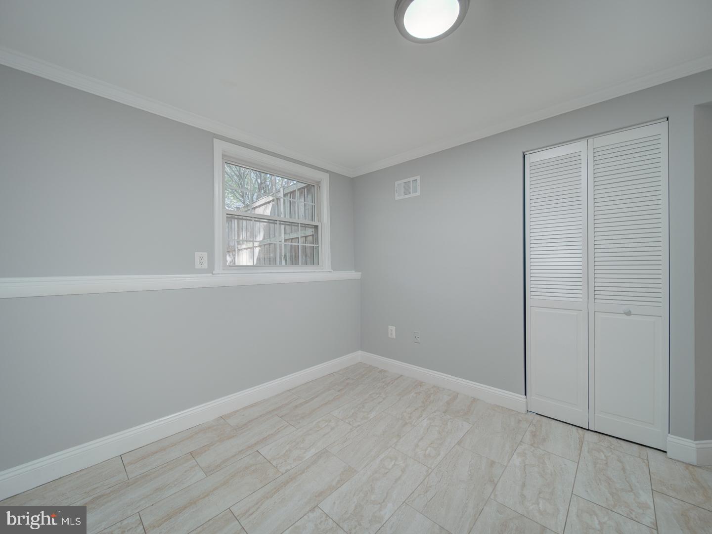 1300 East Beech Road Sterling, VA 20164 - Photo 20 of 35 wooden floor in an empty room with a window