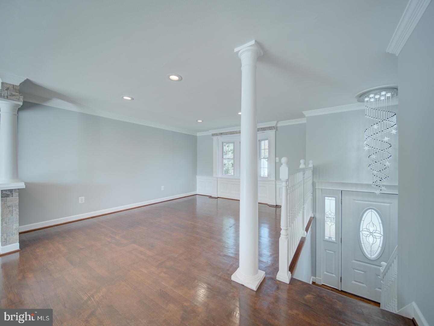 1300 East Beech Road Sterling, VA 20164 - Photo 2 of 35 a view of an empty room with wooden floor and a window
