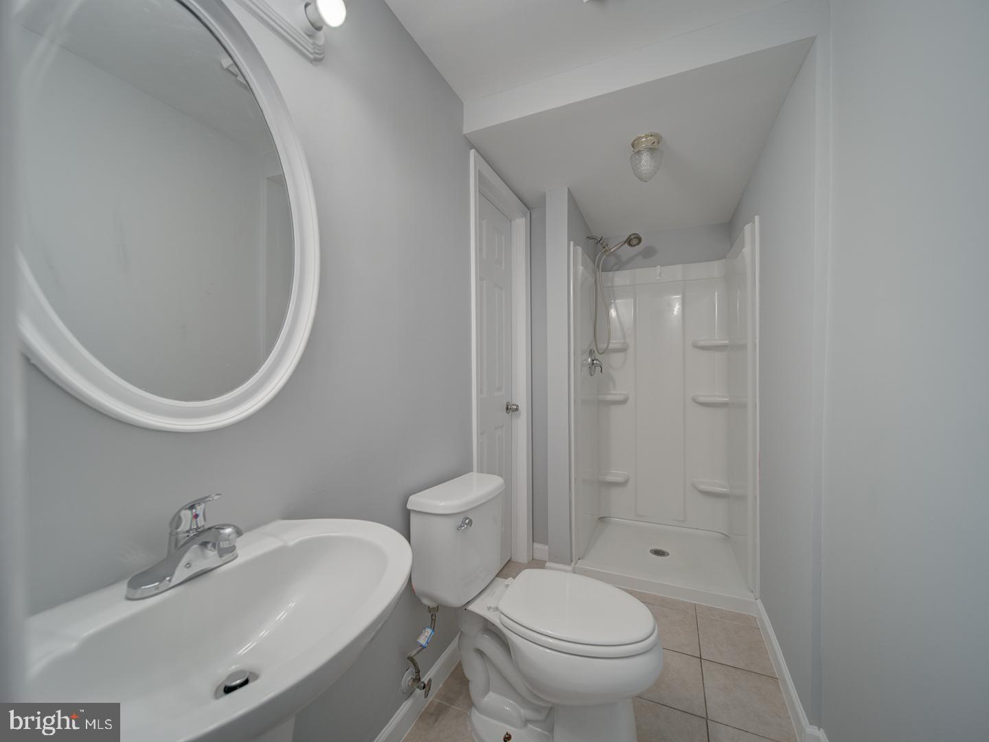 1300 East Beech Road Sterling, VA 20164 - Photo 24 of 35 a bathroom with a sink a toilet and shower