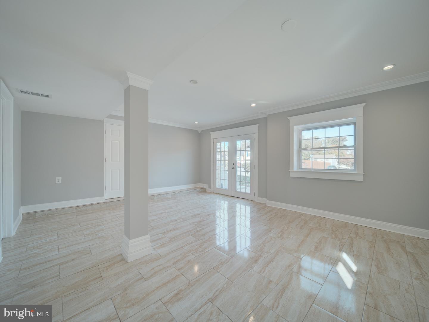 1300 East Beech Road Sterling, VA 20164 - Photo 26 of 35 a view of an empty room with wooden floor and a window